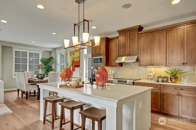 Oversized kitchen island makes for the perfect centerpiece. Photo for illustration purposes only & not of actual home available for sale. Elm design by Toll Brothers built in a previous community.