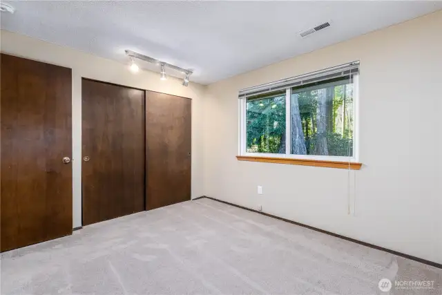 Bedroom 3 facing the green space behind the home.