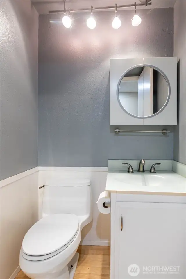 Powder room between kitchen and den.