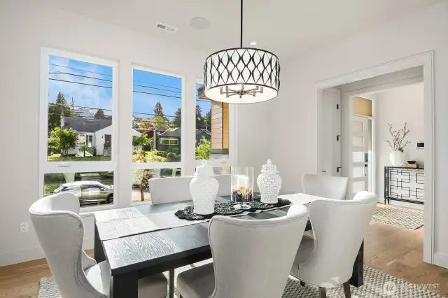 Picture yourself hosting unforgettable gatherings in this elegant Formal Dining Room, offering a sophisticated view of the entrance and the charming front street. Perfect for making a lasting impression on your guests, this space sets the stage for any occasion