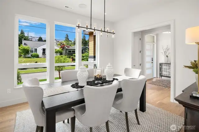 Picture yourself hosting unforgettable gatherings in this elegant Formal Dining Room, offering a sophisticated view of the entrance and the charming front street. Perfect for making a lasting impression on your guests, this space sets the stage for any occasion