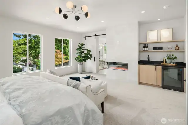 The Primary Bedroom Beverage Station is a true highlight; featuring a sleek sink with a convenient refrigerator, perfect for storing drinks, medications, or natural beauty products. This thoughtfully designed space adds both function and flair to your Sancturay!