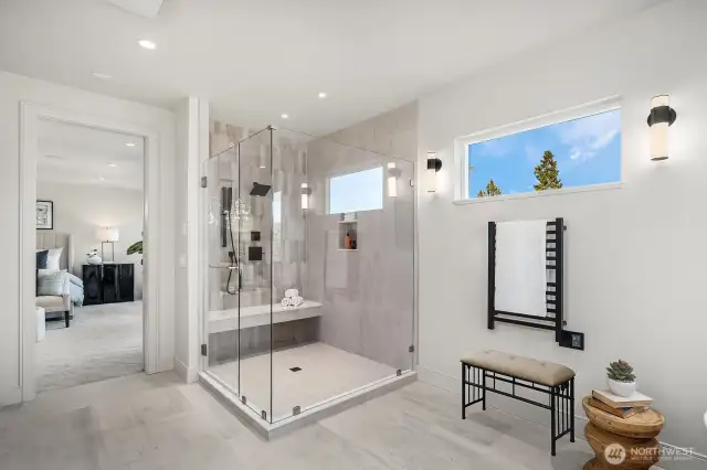 Looking from the Primary Bathroom to the double head shower with bench and towards the bedroom.