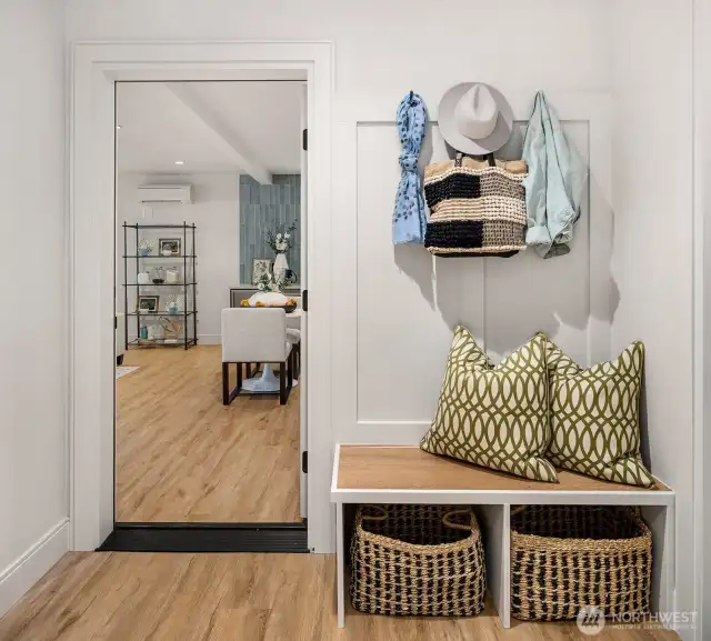 The lower-level landing, conveniently located at the base of the stairs and entrance from the garage, features a practical bag and coat drop zone, perfect for a quick and organized in-and-out. This space also provides access to the lower-level Guest/ADU area, offering both functionality and ease.