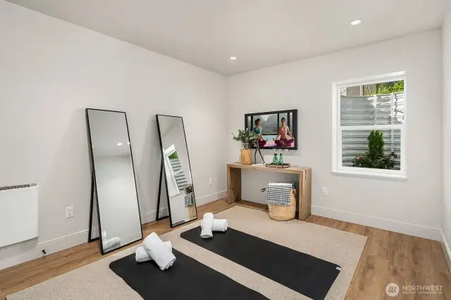 The 5th bedroom of this home located on the lower level is a flex room; Imagine your own use of this space as a; Work out / Office / Bedroom /Game Room.