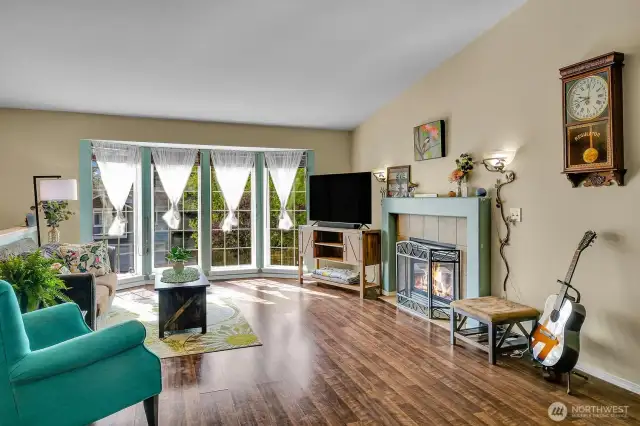 Wall of Windows in the Living Room bringing the Outdoors In with an abundance of Natural Lighting!