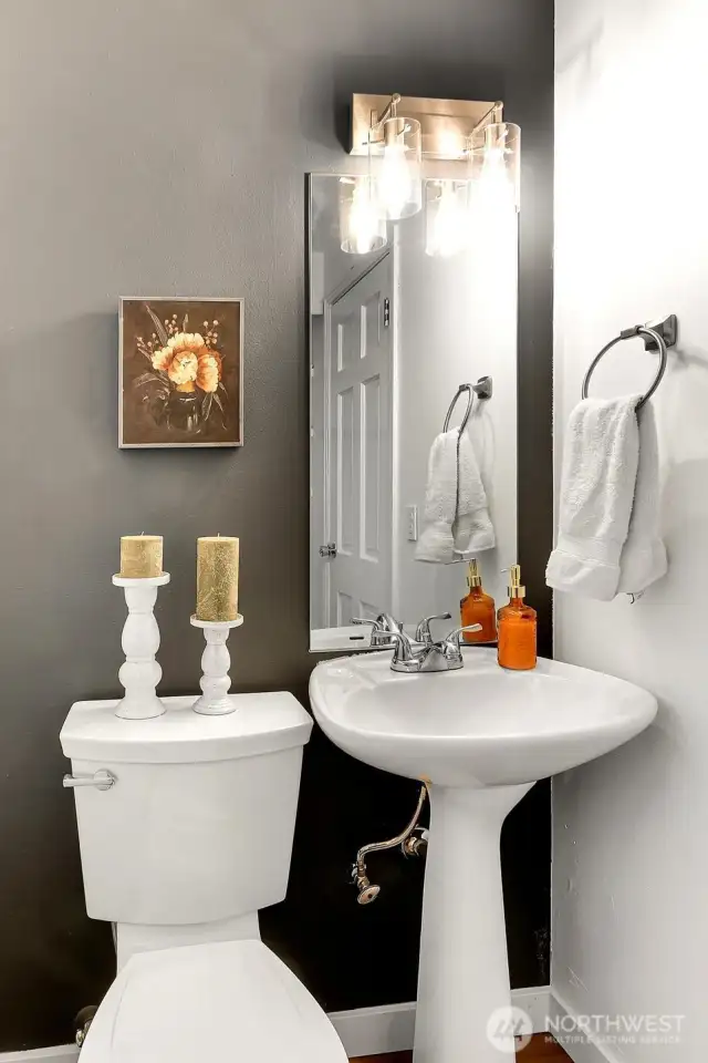 Convenient main floor powder room is perfect for guests and everyday ease.