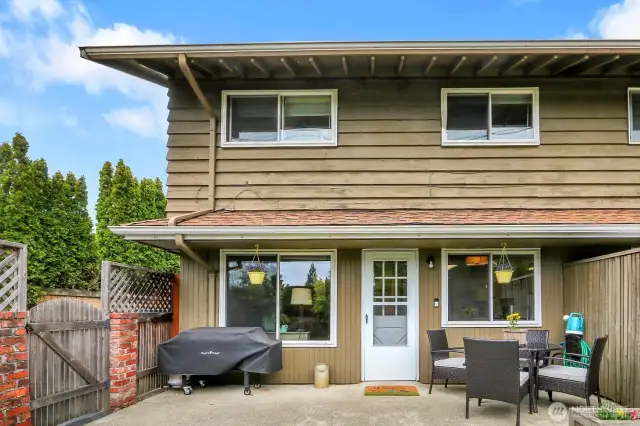 Entertain with ease on the spacious patio with direct access to your private driveway for added convenience.