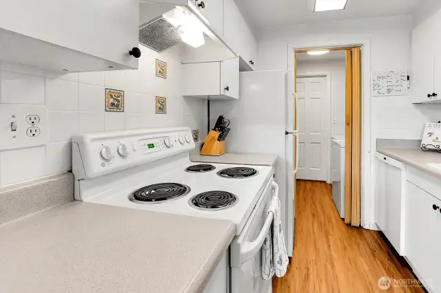 A well equipped cooking zone with classic tile accents.