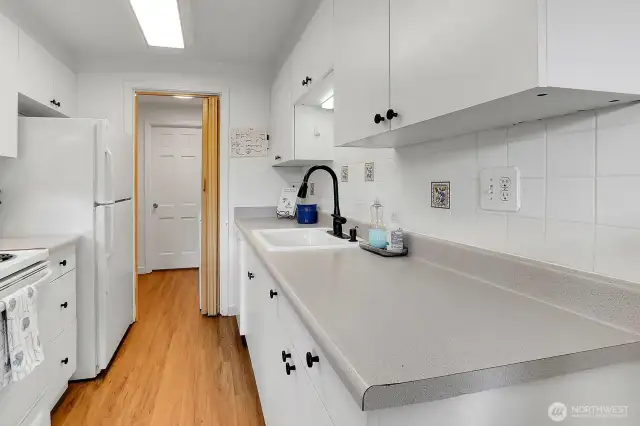 A thoughtfully placed laundry area just off the kitchen adds everyday ease and functionality to the home’s layout.