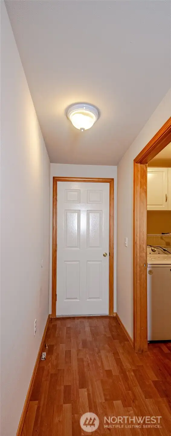 Hallway leading to laundry room and 2 car garage