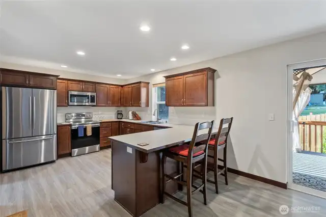 Kitchen with eating space, and room for a large dining table as well.