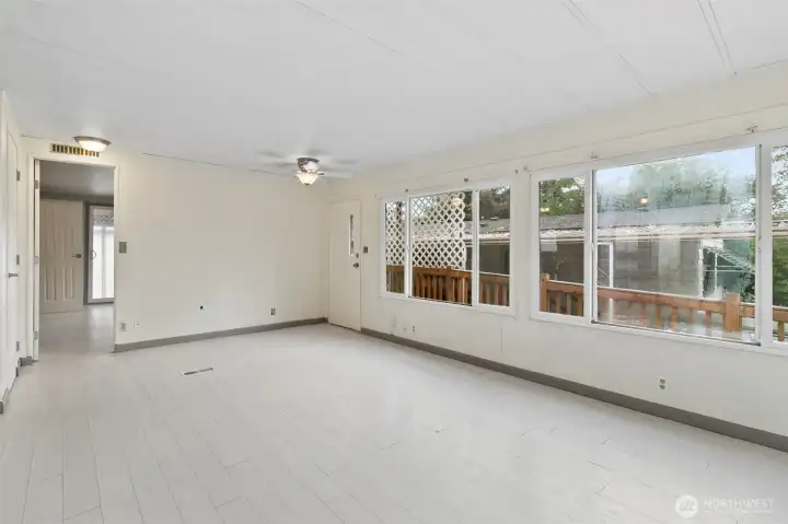 Living room looking at primary bedroom door.