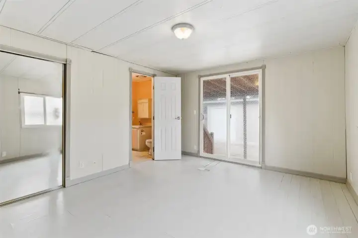 Primary Bedroom 15'x11' with 3/4 bath and slider to back deck.