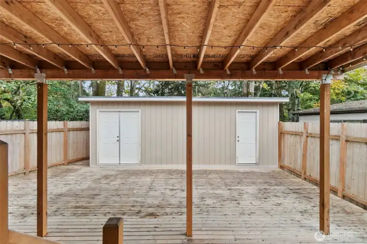 Back deck with large storage shed.