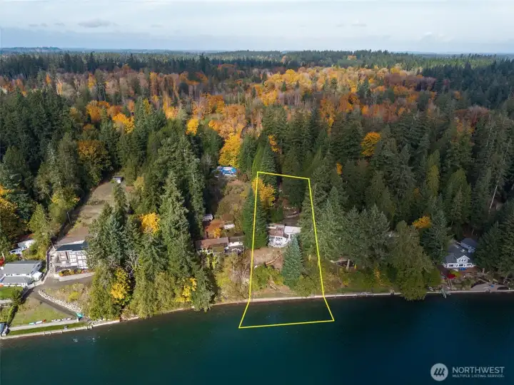 A gradual, landscaped path and new stairs to the bulkhead lead followed by concrete steps to the beach, land you on a smooth gravel beach.  The 1+ acre lot enjoys 107' of waterfront and tidelands.