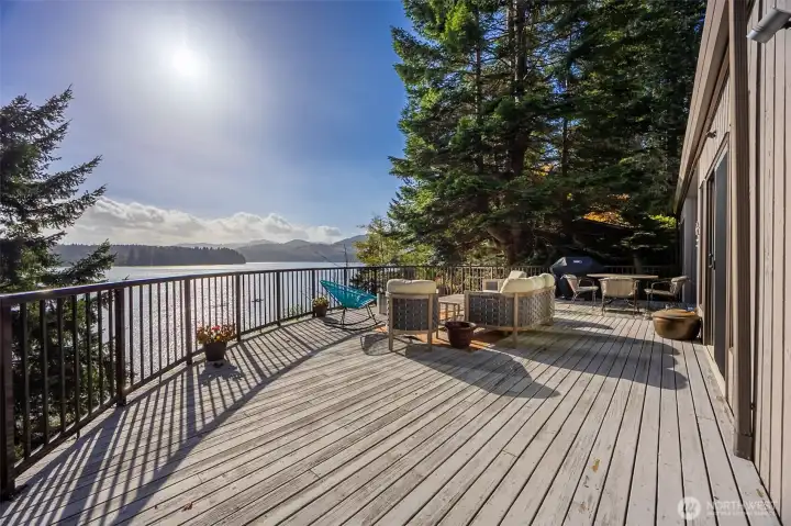 Rest and relax winter, spring summer of fall on this light-filled, expansive deck with hot tub and easy access to the kitchen, family room, dinning room and living room.  Light your winter gas firepit and bring in the New Year.