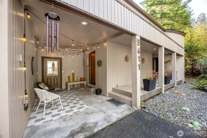 A welcoming breezeway keeps your dry or shaded as you connect to the utility entrace and kitchen from the garage and well filter area.  From the plentiful guest parking, the covered porch leads to the front entrance.