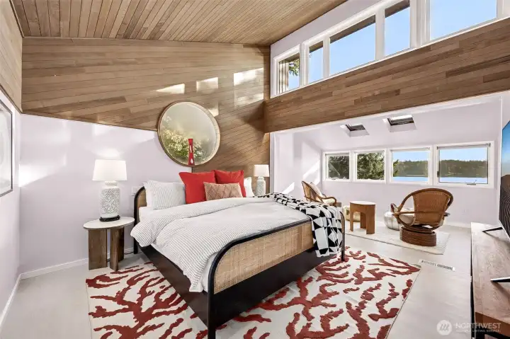 Enjoy views and sky from the sitting alcove of this generous master suite with plenty of wall space for your furnishings.