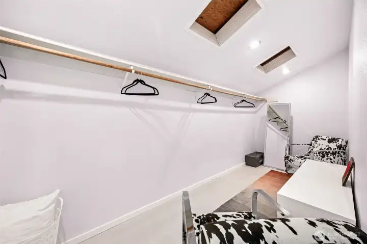 This massive walk-in, under eave primary closet is primed for your version of closet organization.