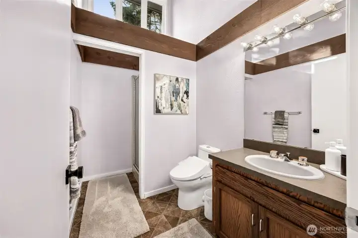 The second upper 3/4 bath serves the occupant of the second bedroom.  Newly installed bidet-style comfort toilet.