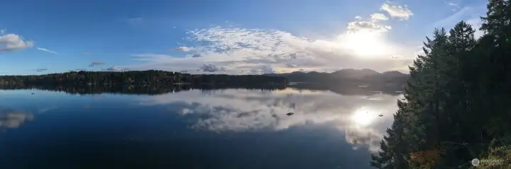 This close-in waterfront property lends easy and quick access to services and a miles from nowhere feel perfect for day to day living, a vacation home or a lucrative vacation rental. West Olympia shopping and medical nearby.