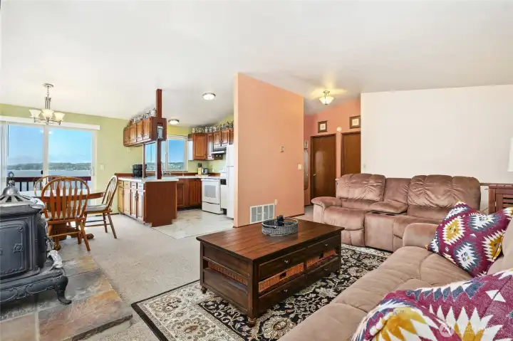 Open concept living area with lots of  natural light, large slider out to the brand new deck for incredible Southerly views of the Puget Sound, Mt Rainier & the Olympic Mtns.