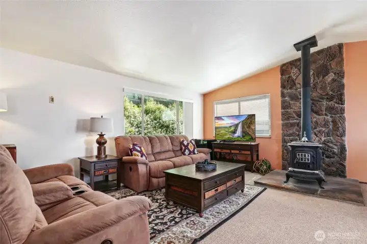 Spacious & bright, open concept living area with vaulted ceiling.