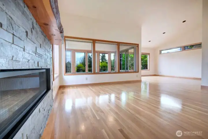 Gas fireplace adjacent to sunroom