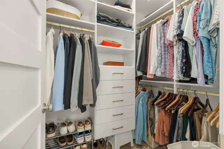 Large walk in closet off of the primary with custom built ins
