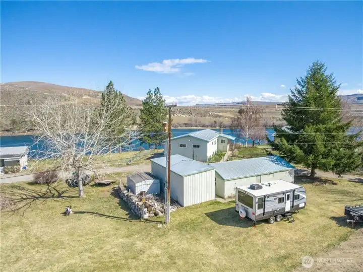 The house sits on .70 of an acre.  It has three out buildings including an RV/boat sized garage, a garden shed and a large shop.