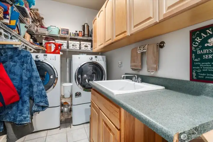 Laundry room off the great room and leading to the 3rd bedroom