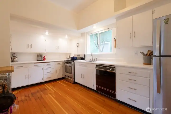 Bright and airy kitchen with character-rich details and modern upgrades for everyday living.