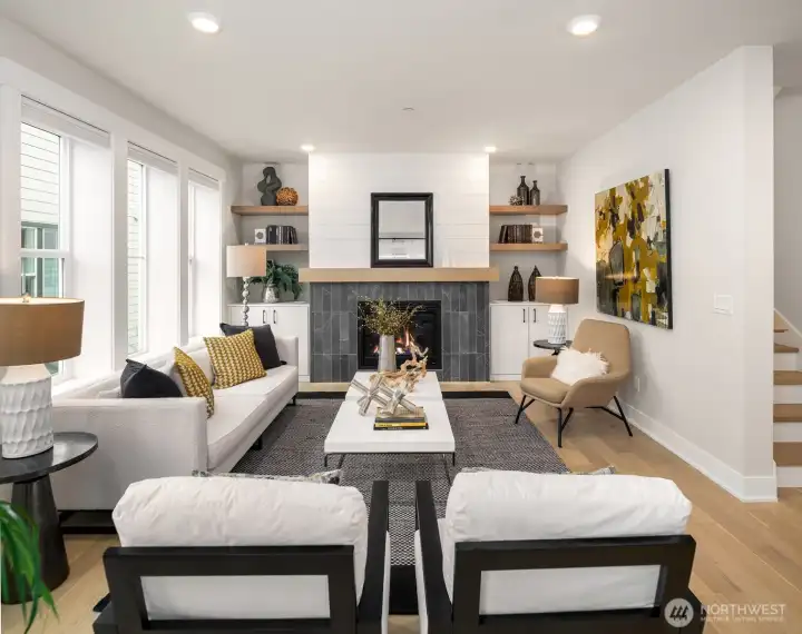 Aloha and welcome to Harvest, a vibrant wine country community in the heart of Woodinville. Ideally positioned within the neighborhood for added privacy, this beautifully designed living room centers around a custom fireplace feature wall.