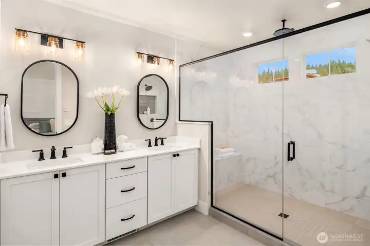 Spa-inspired primary bathroom with dual vanity, quartz counters, and modern fixtures.