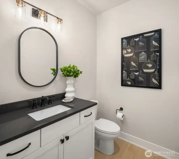 Stylish powder room with contemporary vanity and fixtures.