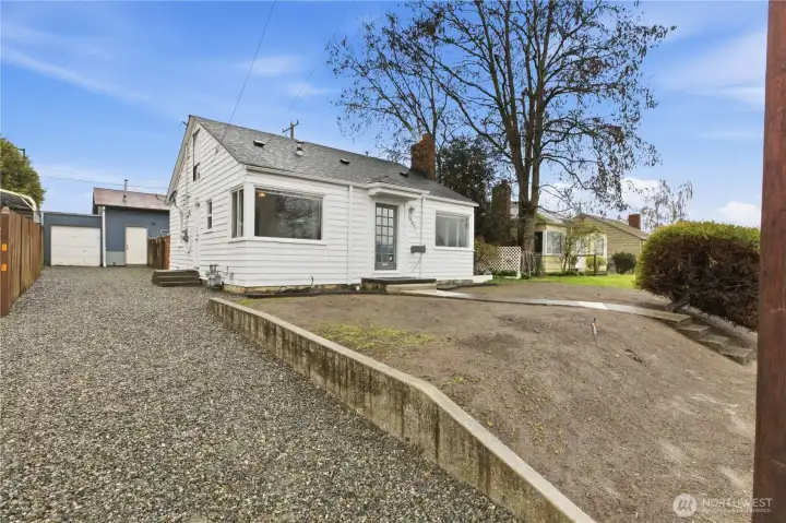 Driveway with access to garage and parking.