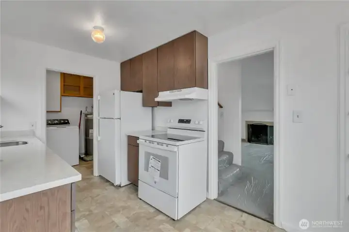 Kitchen with access to living room and stairs to the upstairs bedrooms.