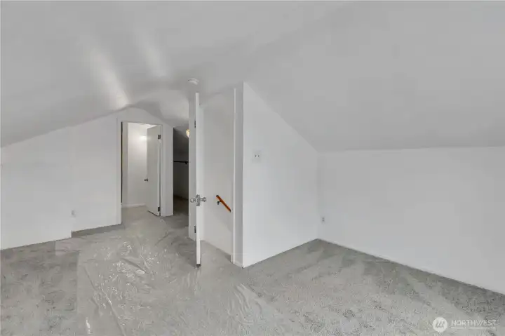 Upstairs primary bedroom with large closet and bathroom.