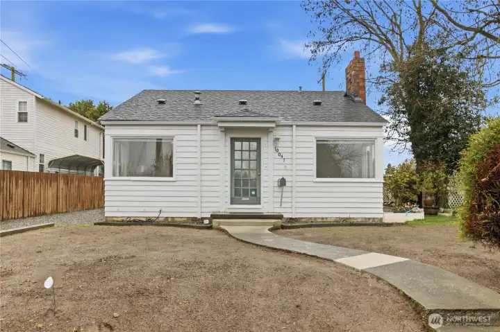 Front of home and cement walkway to the home.