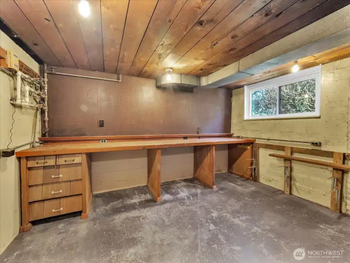 Workshop complete with peg board and work bench.