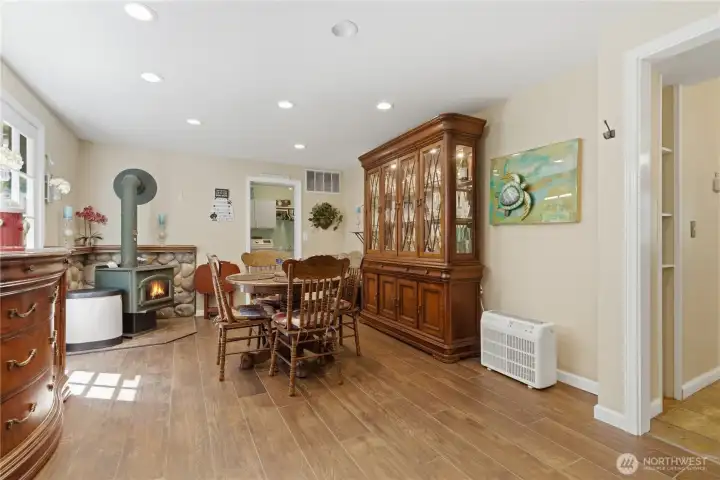 Gather around the free standing wood stove which makes this area warm and cozy.