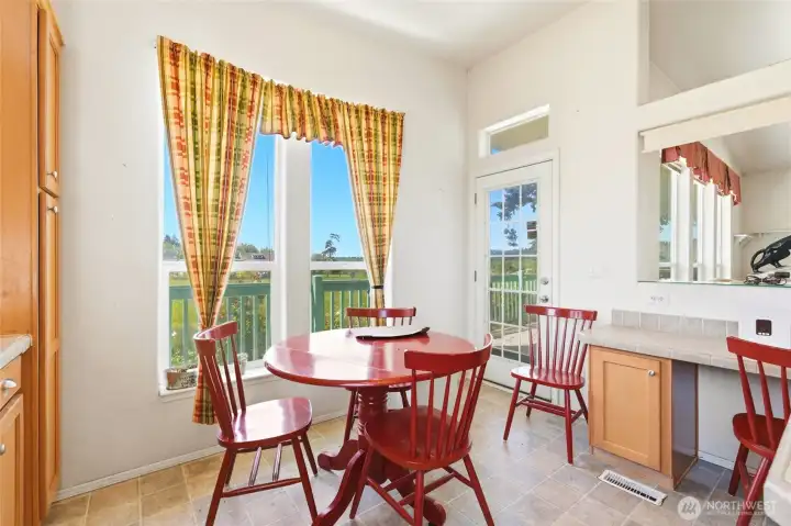 Dining area off of kitchen, more windows for abundant natural light.