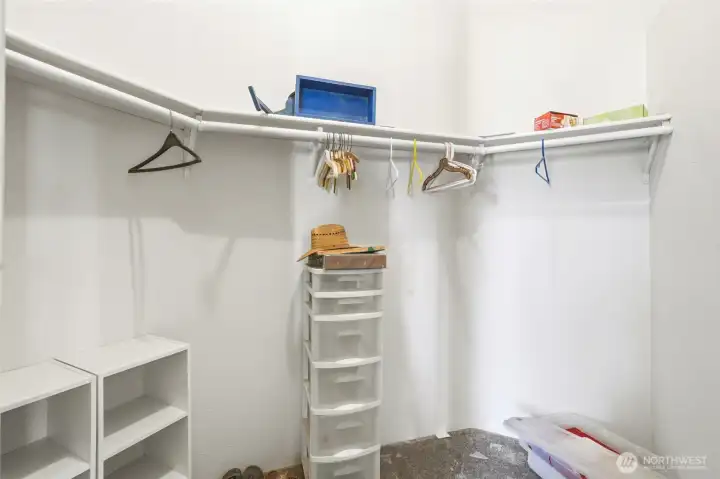 Primary bedroom walk in closet