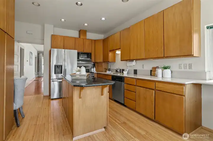 Kitchen features stainless steel appliances  and ample counter space.