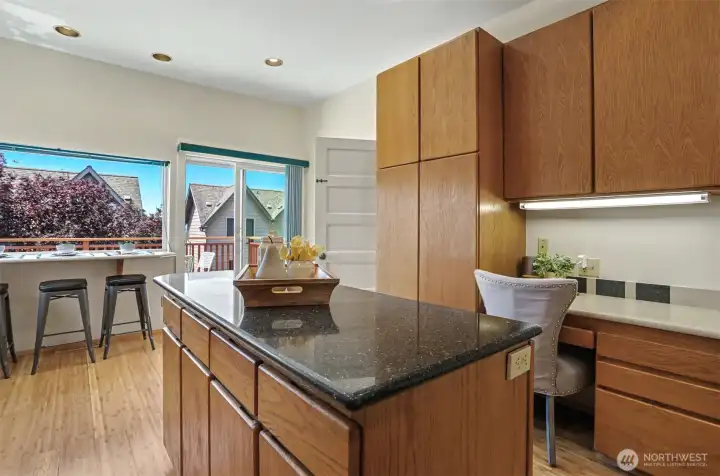 The eat-in kitchen is also home to a computer desk perfect for a home office, craft space, or homework help.