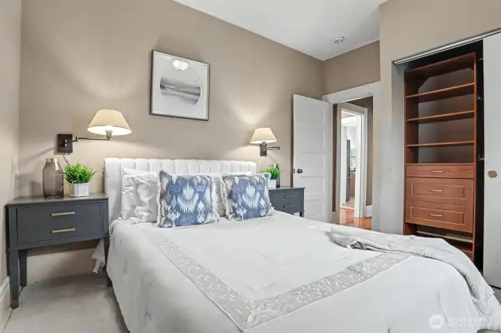 Primary bedroom is accessible off main living space.