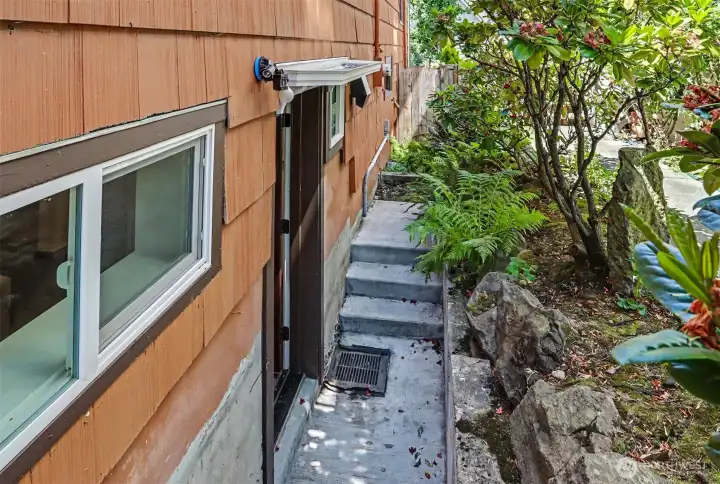 Additional downstairs living space features own private entrance.