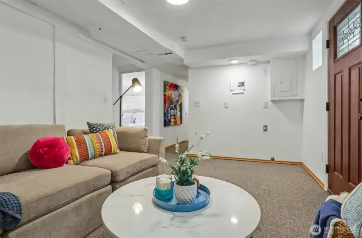 Downstairs living room is prepped and ready for a small kitchenette - possibly turning this lower level into an income-generating unit? Buyer to verify!