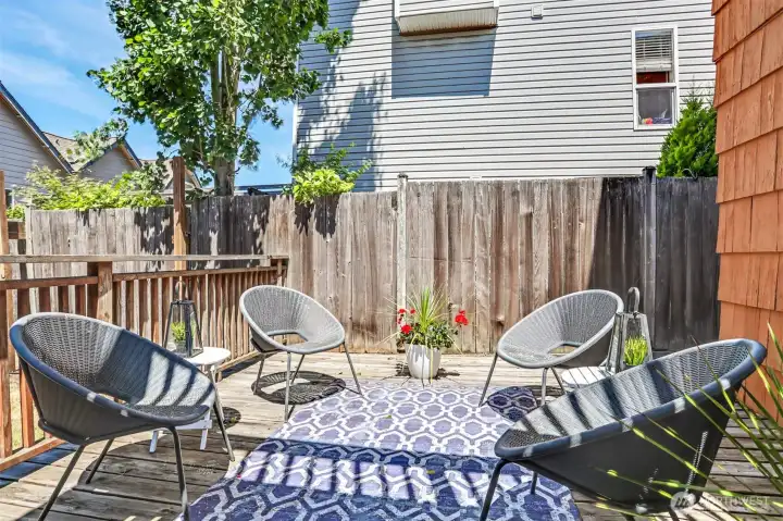 Downstairs deck perfect for indoor-outdoor living in Seattle summers.